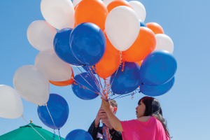 Pepperdine event with orange and blue balloons outside