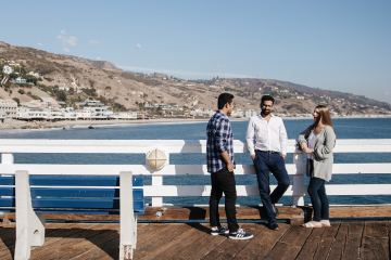 Full-Time MBA students standing on the Malibu Pier