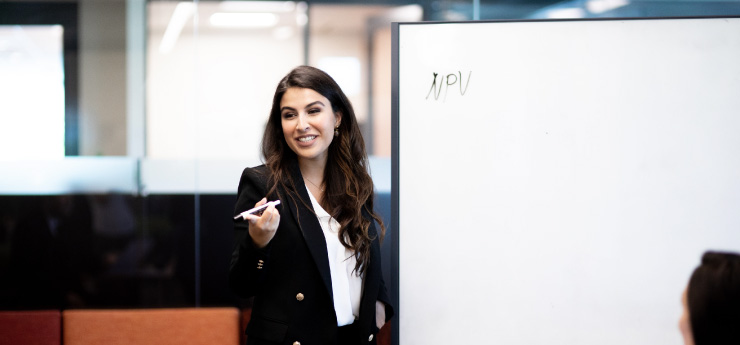 Diversity council member at whiteboard