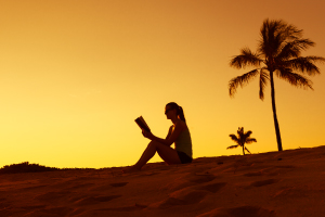 Graziadio student reading the Bible at the beach