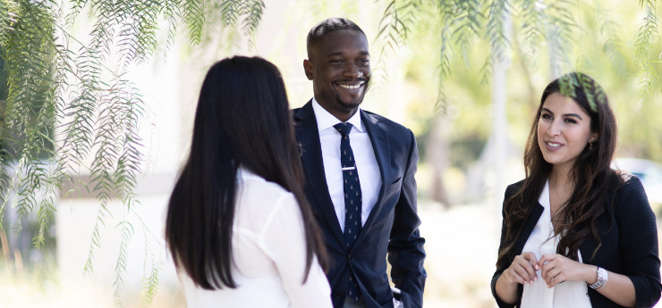 Diverse students attending class on a scholarship