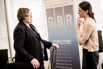 Dr. Marlene Biseda interacting with student