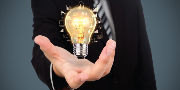 Businessman holding light bulb