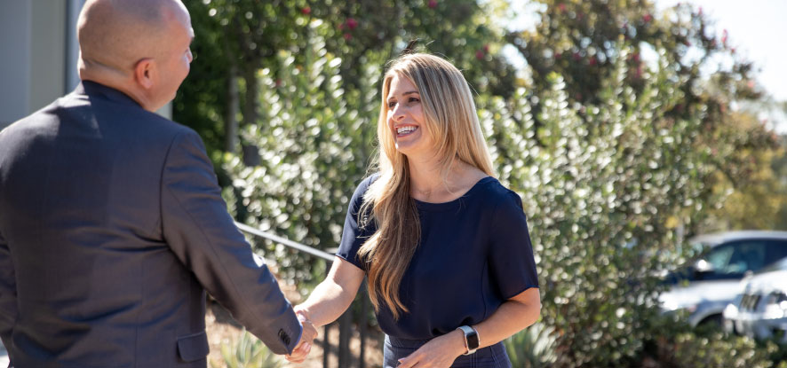 Two students shaking hands