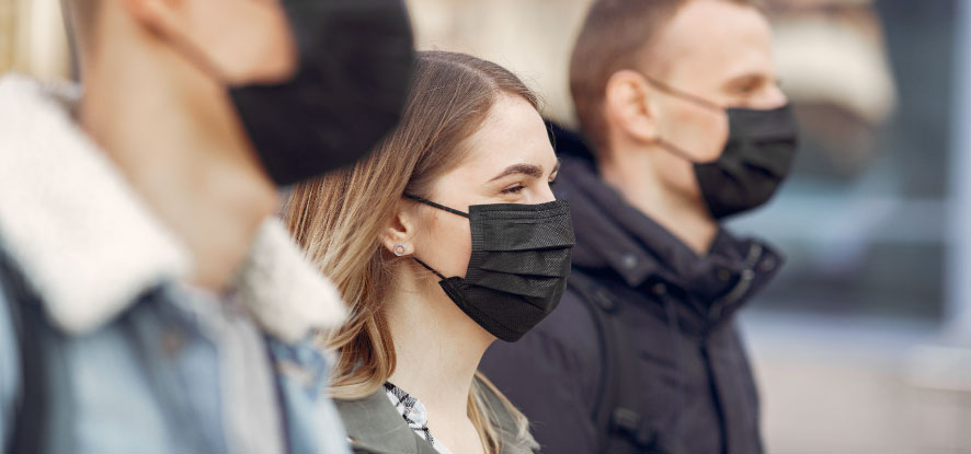 Students looking forward wearing face masks