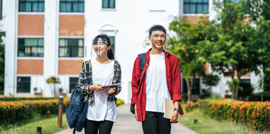 Students walking outside of campus during a pandemic