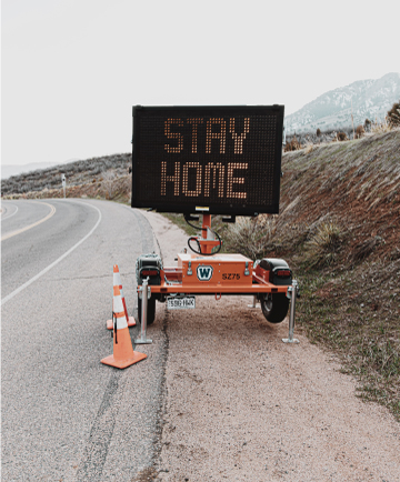 Stay home sign on the side of the road in Malibu, California