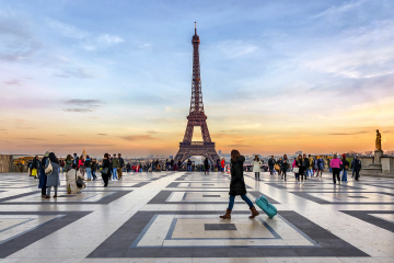 Student walking near Paris Eiffel Tower
