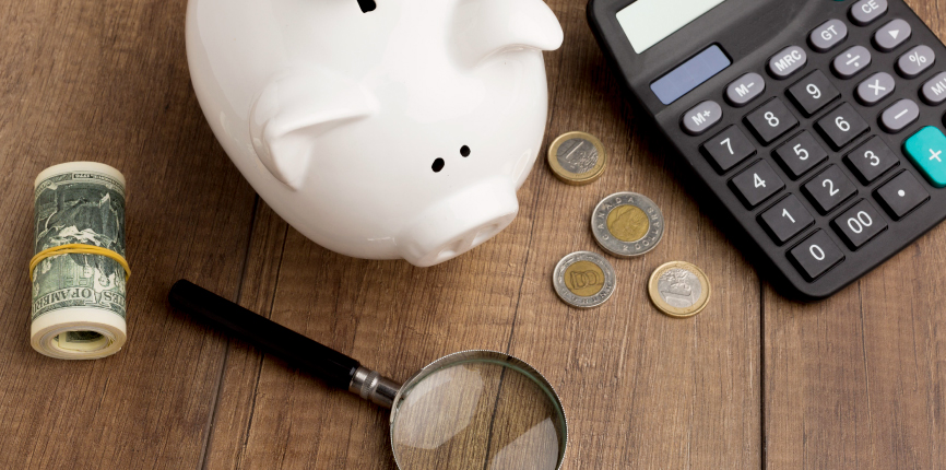 Piggy bank, money, and finances on a desk