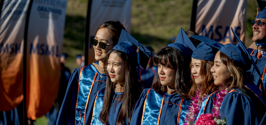 International students together at graduation ceremony at Drescher Campus