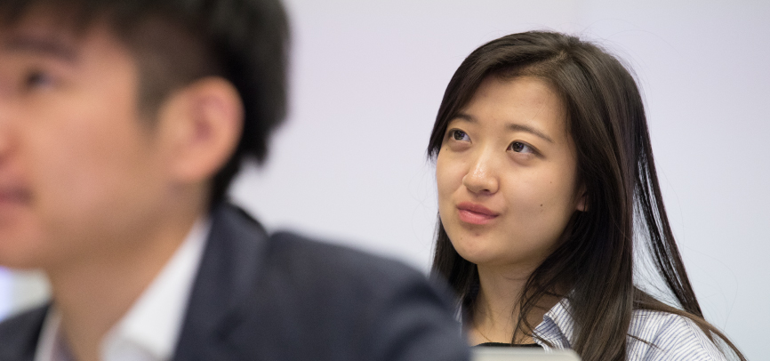 Student listening to classroom lecture