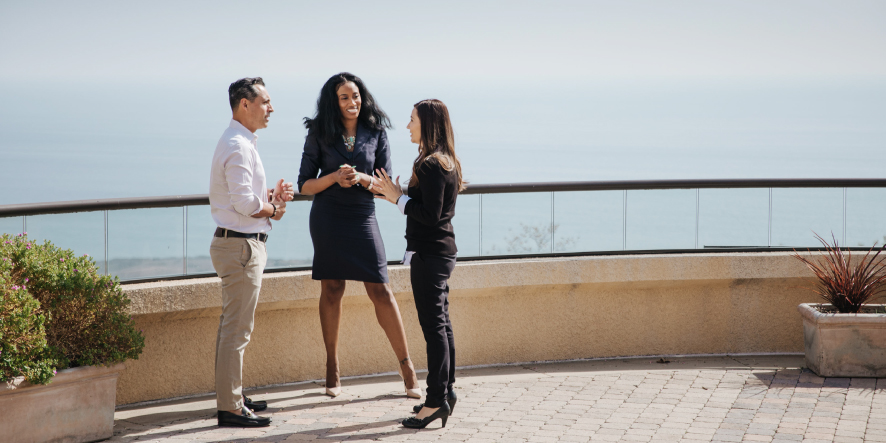 Three students talking at Drescher Campus