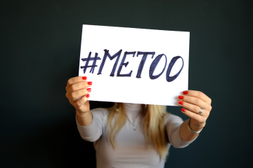 Woman holding MeToo movement sign