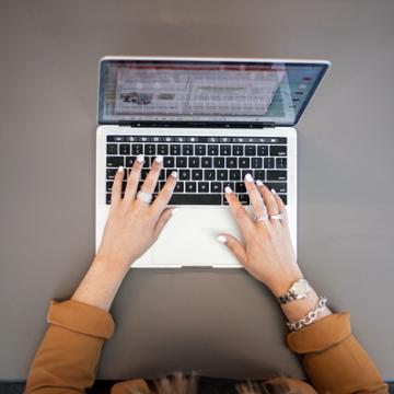Typing on laptop