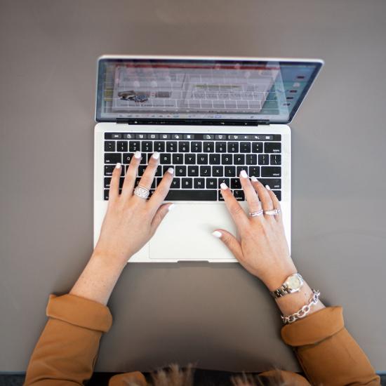 Typing on laptop