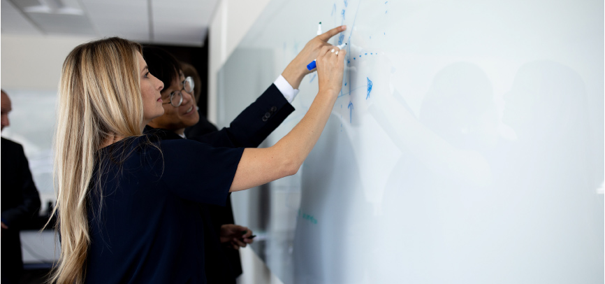 Student at whiteboard in classroom