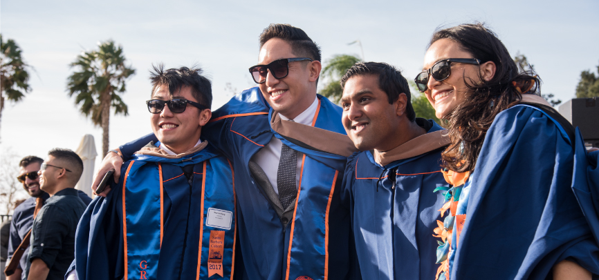 Students cheering after Graziadio commencement ceremony